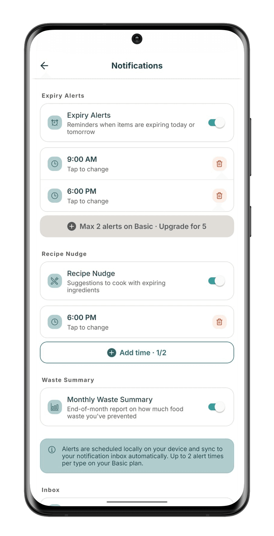 StillGood notification settings on Basic: expiry alerts at 9:00 AM and 6:00 PM, a note reading max 2 alerts on Basic, and a monthly waste summary toggle